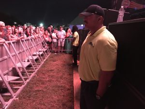 Security personnel guarding stage